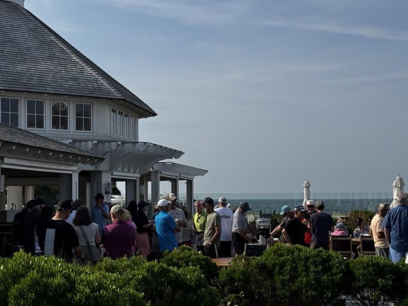 Guests gathering on the terrace overlooking the harbor