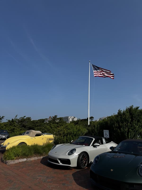 Guests and cars on the club grounds