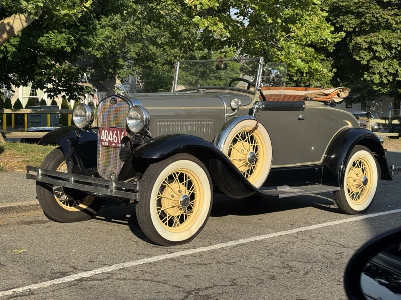Classic car parked along the village street
